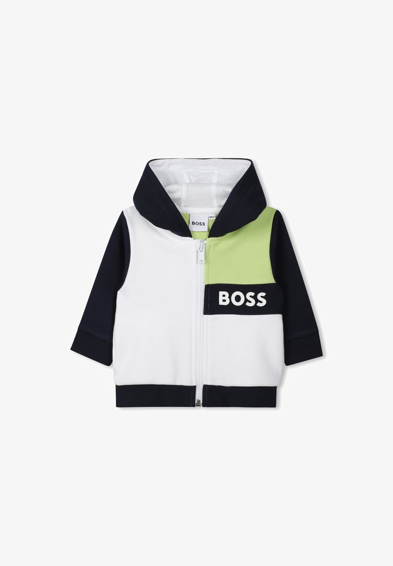 Hoodie zippé en blanc, marine et vert ; présente un grand logo sur le devant, un design bicolore et un tissu doux et texturé.