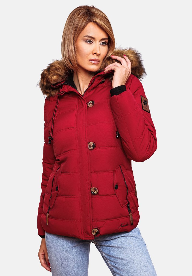 Red insulated jacket with a fur-lined hood, quilted texture, large buttons, and side pockets. Features black accents and a logo patch.
