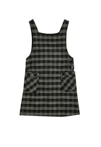 Vestido a cuadros con un patrón de cuadros en blanco y negro, escote cuadrado y dos bolsillos frontales. Hecho de tela texturizada. Presenta botones en los laterales.