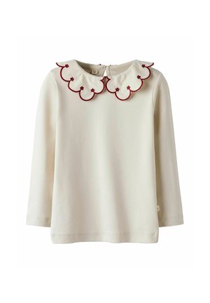 Blusa de manga larga beige con un cuello burdeos con volantes. Tiene una cremallera en la parte trasera y está hecha de una tela suave. Sin patrones ni adornos adicionales.