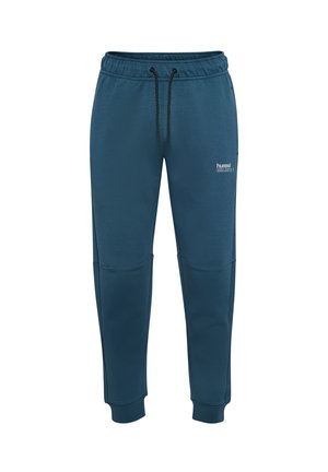 Mørke teal joggingbukser lavet af blødt stof, med elastisk talje og snoretræk, smalle ben og knæpaneldetaljer.