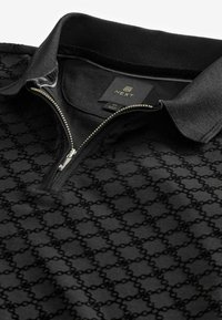 Next FLOCKED - Polo majica - black