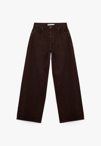 Brune vide ben jeans lavet af bomuldsdenim, med høj talje, frontlommer og en rå kant ved anklen. Klassisk design med fem lommer.