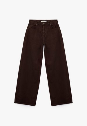 Bruine wijde jeans van katoen denim, met een hoge taille, voorzakken en een onafgebroken zoom bij de enkel. Klassiek vijf-pocket ontwerp.