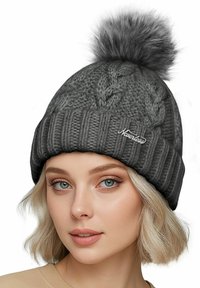 Gray knitted beanie with a ribbed brim and a large, fluffy pom-pom on top. Features a textured cable pattern and embroidered logo.