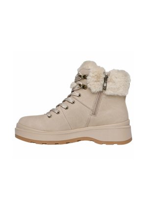 Bottines en daim beige avec un col en fausse fourrure, laçage traditionnel, fermeture éclair sur le côté et semelle épaisse pour plus de grip et de confort.