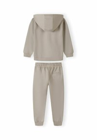 Beige hooded sweatshirt and matching joggers, made of soft fabric. Sweatshirt features a front pocket; joggers have an elastic waist and cuffs.