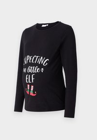 Black long-sleeve maternity shirt featuring white text "Expecting a Little Elf" with green and red elf shoes at the bottom. Soft cotton material.