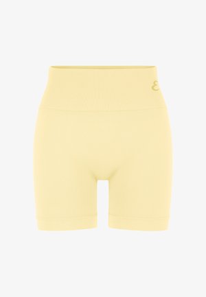Pantaloncini da ciclista a vita alta senza cuciture di colore giallo chiaro con ampia fascia a coste in vita e piccolo dettaglio logo sul lato sinistro.