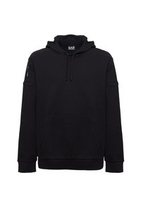 Felpa nera in cotone con cappuccio regolabile, tasca a marsupio frontale e polsini a coste. Design minimalista senza motivi o loghi visibili.