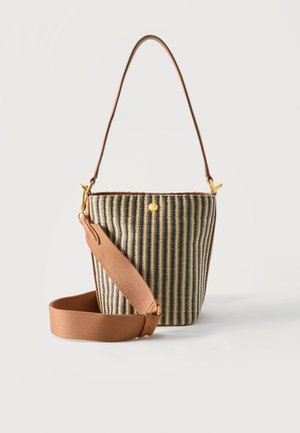 Small bucket bag with vertical black and beige stripes, tan adjustable shoulder strap, and thin handle against a white background.