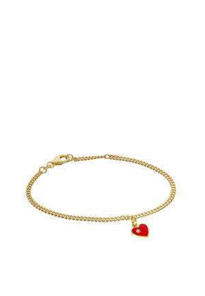 Gold chain bracelet with red heart-shaped charm featuring a small clear gemstone at its center and lobster clasp closure.