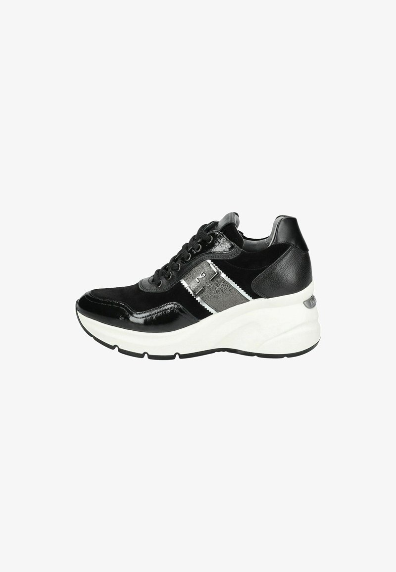 Black sneaker featuring glossy leather and suede accents, a white thick sole, grey panel, and black laces. Side logo detail present.