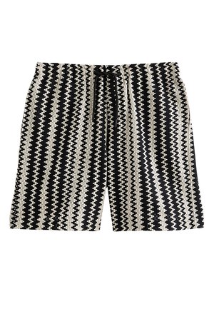 Zwart-witte zigzag gebreide shorts met een elastische tailleband en zwarte aantrekkoorden aan de voorkant.