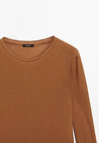Brown long-sleeve crew neck shirt with a small black label on the inner collar reading "Massimo Dutti Made in Portugal."