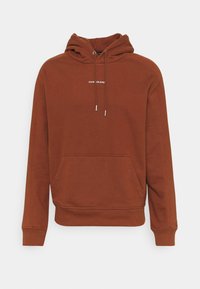 Felpa con cappuccio marrone realizzata in tessuto misto cotone, con tasca frontale, cordini e logo "CALVIN KLEIN JEANS" in bianco.