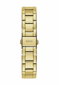 Auksinis metalinis laikrodis su grandinėlės dizainu ir poliruotu paviršiumi. Ant užsegimo yra „GUESS“ logotipas.