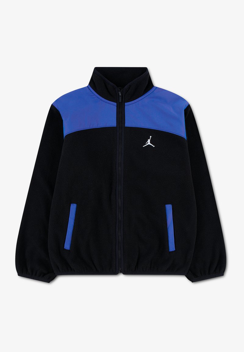 Veste zippée noire et bleue avec col montant, poignets élastiques, deux poches avant et un logo Jumpman blanc sur la poitrine.