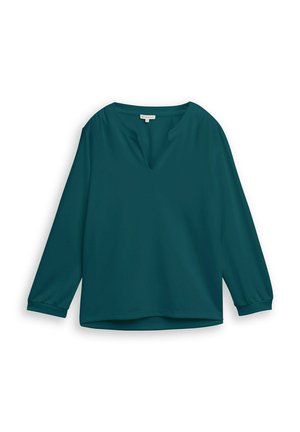 Blouse à manches longues couleur sarcelle avec une coupe décontractée et un léger décolleté en V, dotée de manches retroussées et d'un ourlet droit.