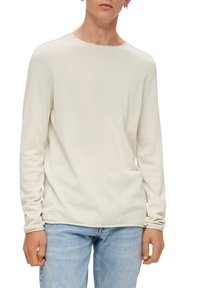 Helle beige Langarmbluse mit Rundhalsausschnitt. Aus sanftem, strukturiertem Material gefertigt. Verfügt über einfache, saubere Nähte und einen entspannten Schnitt.