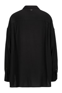 Black long-sleeve shirt with buttoned cuffs, collar, and a small logo patch centered below the collar on the back.