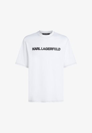 Bílý bavlněný tričko s kulatým výstřihem. Na přední straně se nachází černý vyšitý text "KARL LAGERFELD" a krátké rukávy.