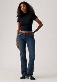 Levi's® SUPERLOW BOOTCUT - Jeans bootcut - sweep down