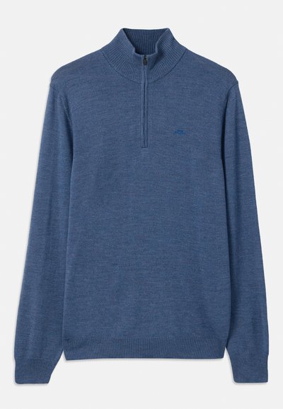 Pulôver azul com fecho por zipper no pescoço. Feito de um tecido de malha macio com punhos e colarinho canelados. Apresenta um logótipo tonal discreto no peito.