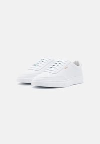 White leather sneakers with a smooth texture, rounded toe, flat white sole, and light blue laces; features a subtle "BOSS" logo on the side.