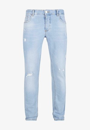 Vaaleansiniset farkut slim fit -mallia, joissa on kulutuksia polvissa ja perinteinen viisi taskua -design.