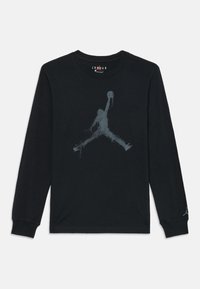 Zwart shirt met lange mouwen van katoen, met een groot grijs Jumpman-logo in een versleten afwerking op de voorkant.