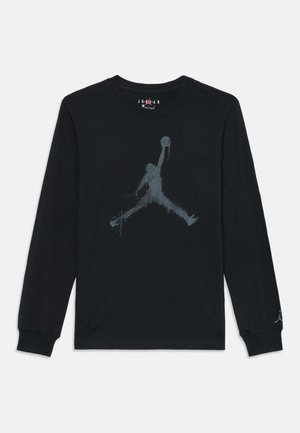 Zwart shirt met lange mouwen van katoen, met een groot grijs Jumpman-logo in een versleten afwerking op de voorkant.