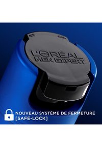 Conteneur bleu avec couvercle noir arborant le logo en relief "L'Oréal Men Expert". Un symbole de verrou et un texte en français indiquent une fonction de verrouillage sécurisé.