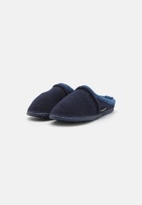 Navy blue wool slippers with a rounded toe, soft texture, and a contrasting blue lining. The sole is dark with visible stitching.