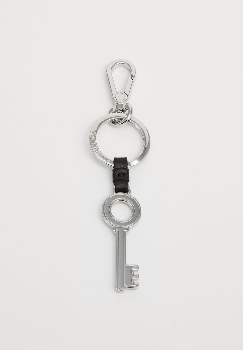 Key-shaped metal keychain with a polished silver finish, attached to a black leather strap and a silver circular ring with a clip.