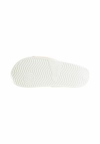 Sole di sneaker bianca con un motivo a zigzag; presenta un logo circolare e il numero di modello "SUL168" stampato in una sezione liscia.