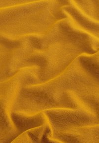 Next Polotričko - amber yellow