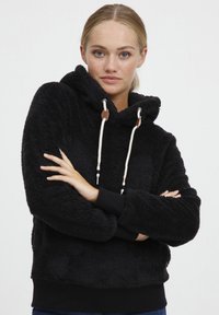 Black fleece hoodie featuring a textured, plush surface, hoodie drawstrings with wood accents, and a fitted waistband.