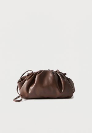 Soft brown leather pouch bag with gathered top and slim strap, resting on white background.
