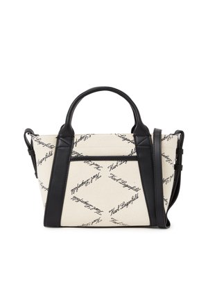 Petit sac à main beige et noir avec deux poignées et une bandoulière, présentant un motif répété de logo script noir sur le tissu.