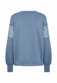 Blue pullover with lace accents on sleeves. Soft, textured fabric; relaxed fit and a round neckline. Long sleeves with ribbed cuffs.