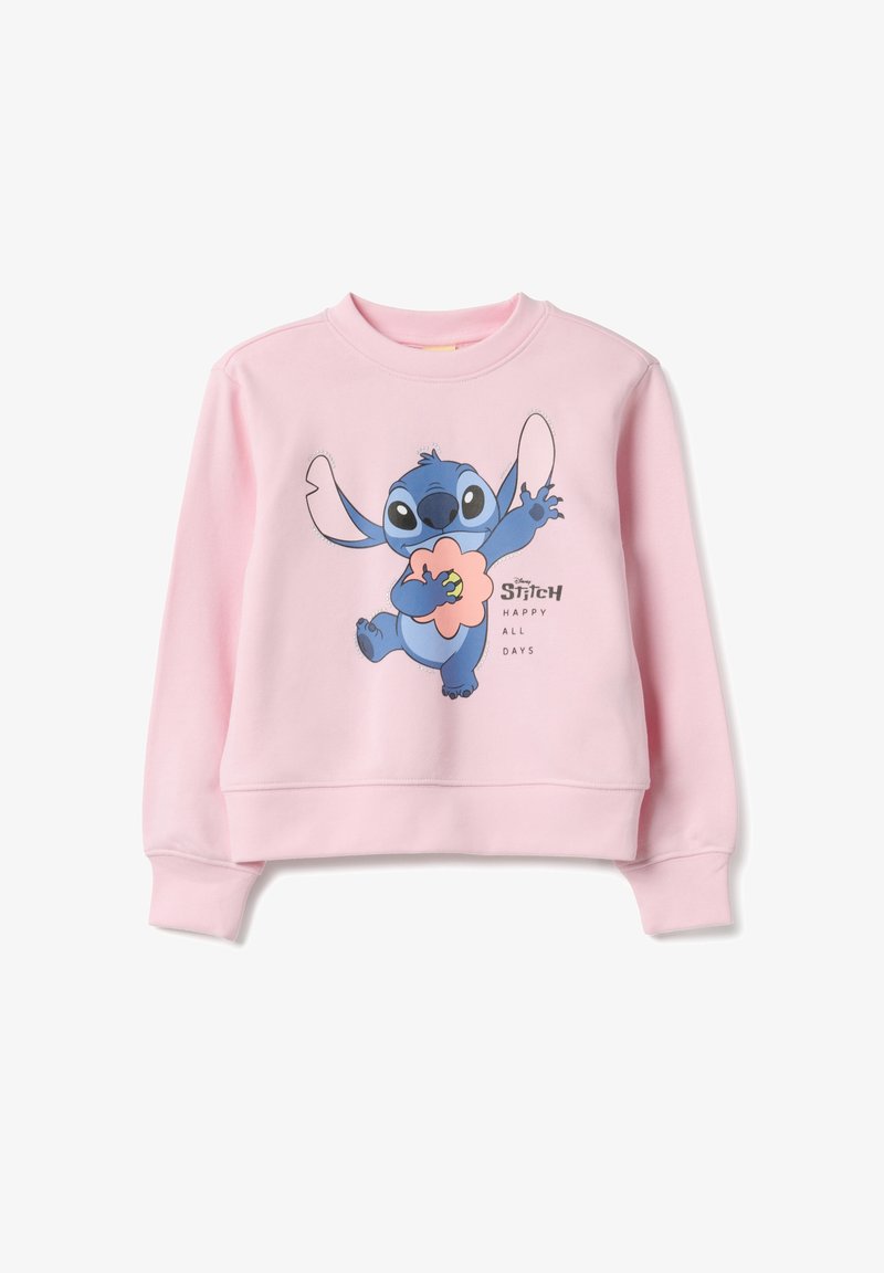 Sweatshirt rose avec un personnage bleu imprimé aux grandes oreilles tenant une fleur. Le design inclut "Disney STITCH" et "HAPPY ALL DAYS."