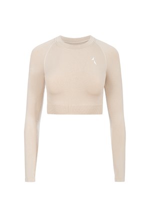 Vaaleanbeige pitkähihaisen kropin toppi, joka on valmistettu sileästä ja joustavasta kankaasta. Siinä on pyöreä kaula-aukko ja pieni valkoinen logo vasemmalla ylhäällä.