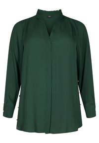 Blusa verde a maniche lunghe in tessuto leggero con colletto rialzato, scollatura a V e bottoni laterali per un tocco di originalità. Texture liscia, vestibilità comoda.