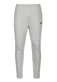 Pantalones de chándal grises hechos de tejido suave, con una cinturilla elástica, puños acanalados y un pequeño logo negro de Nike en el muslo izquierdo.