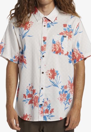 Short-sleeved floral shirt in light beige, featuring red and blue flowers with green leaves, button-down front, and a chest pocket.