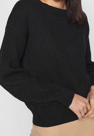Schwarzer, gerippter Strickpullover mit langen Ärmeln und rundem Ausschnitt, mit strukturierter Stoffoberfläche und tailliertem Saum.