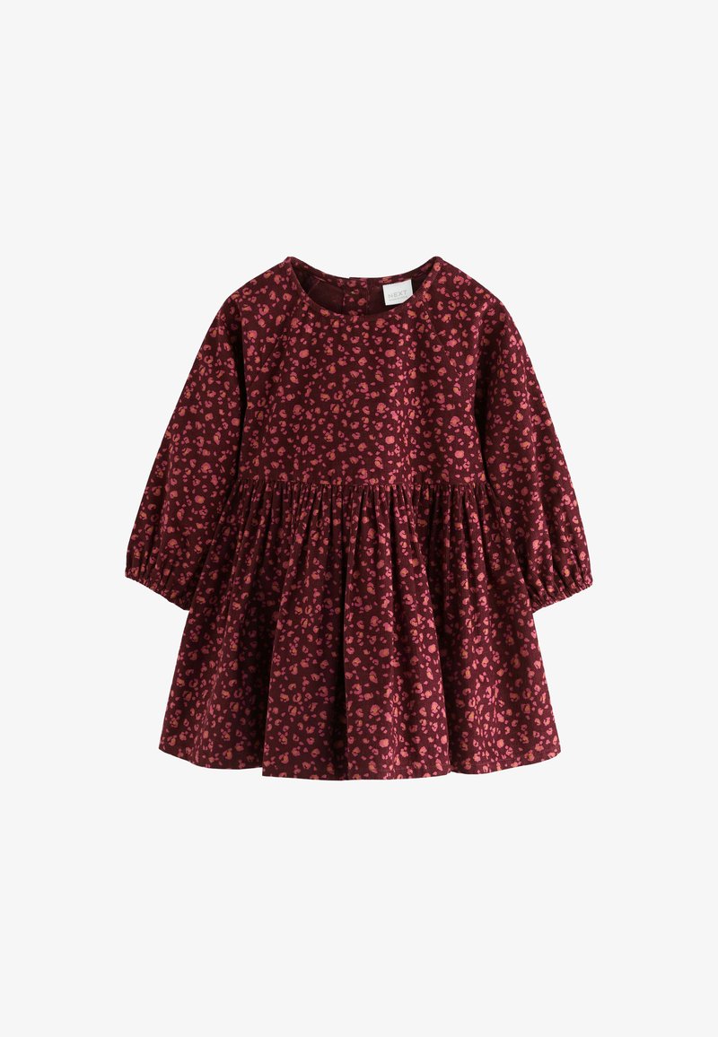 Vestito per bambino con maniche lunghe e gonna arricciata in tessuto rosso scuro con motivo floreale astratto rosa e arancione.