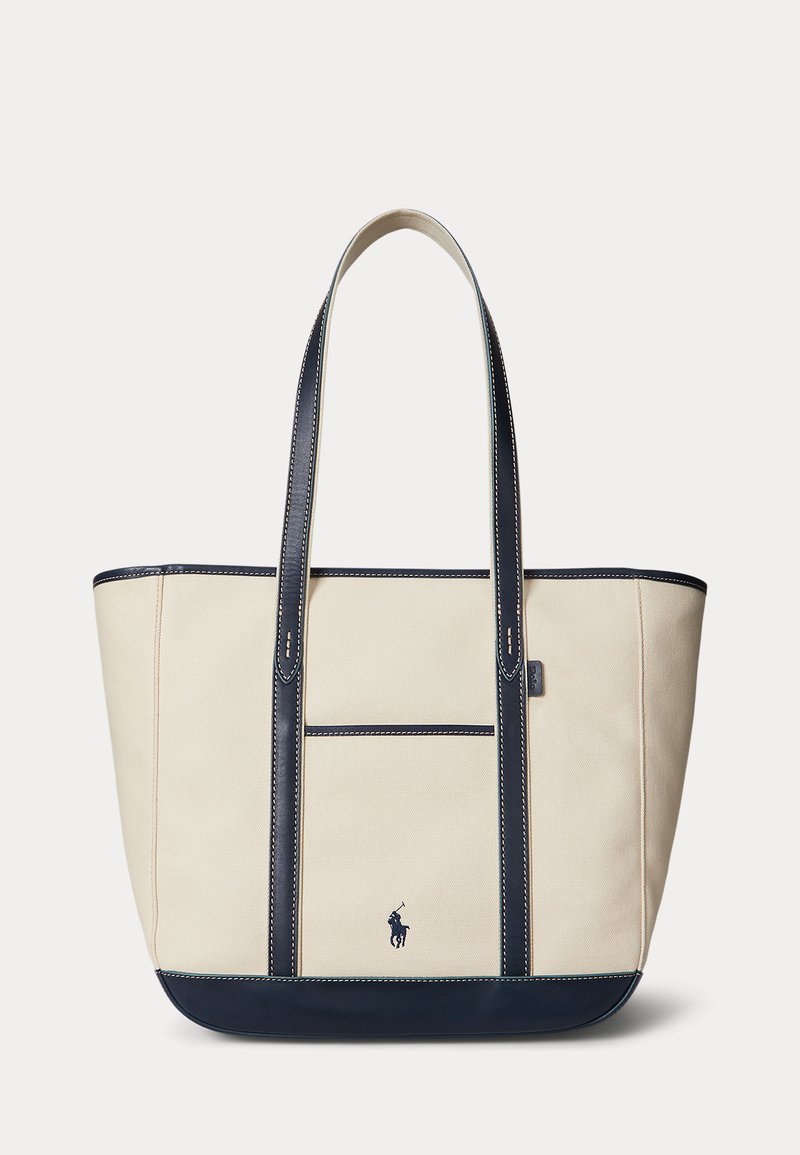 Beige lærredstaske med mørkeblå læderhåndtag, bund og Polo Ralph Lauren-logo, med frontlomme og kontrastsyning.