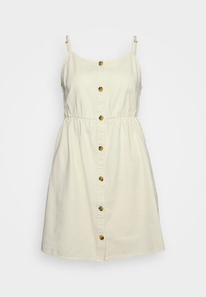 Vestito crema con bottoni frontali, spalline sottili, vita elastica e gonna svasata. Presenta bottoni marroni sulla parte anteriore e una texture del tessuto liscia.